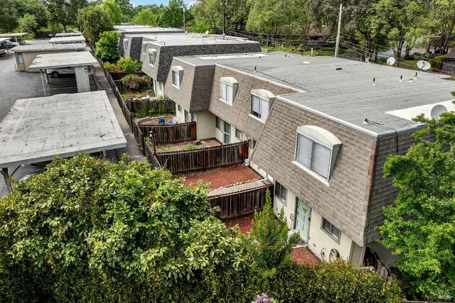 an aerial view of a house with a garden