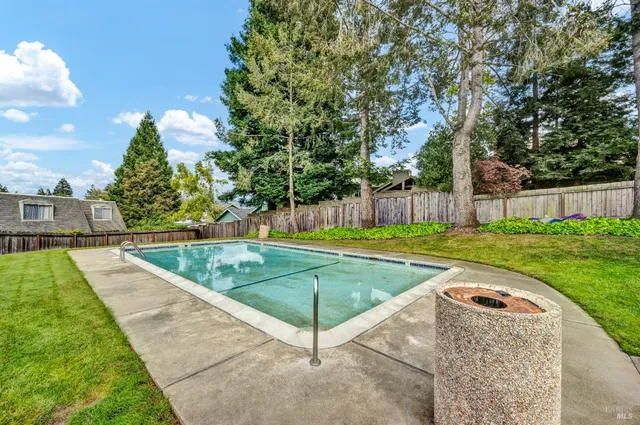 a view of a backyard with sitting area