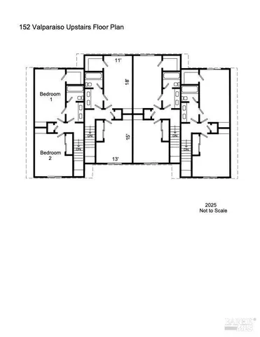 a front view of a house with a yard and a garden