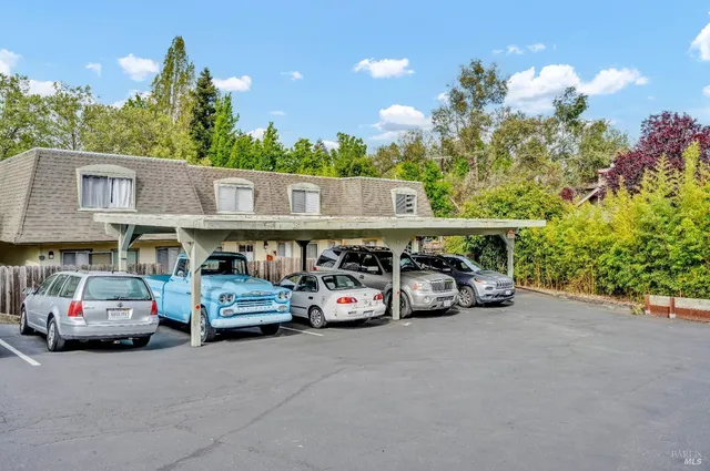 a view of parking space with cars parked