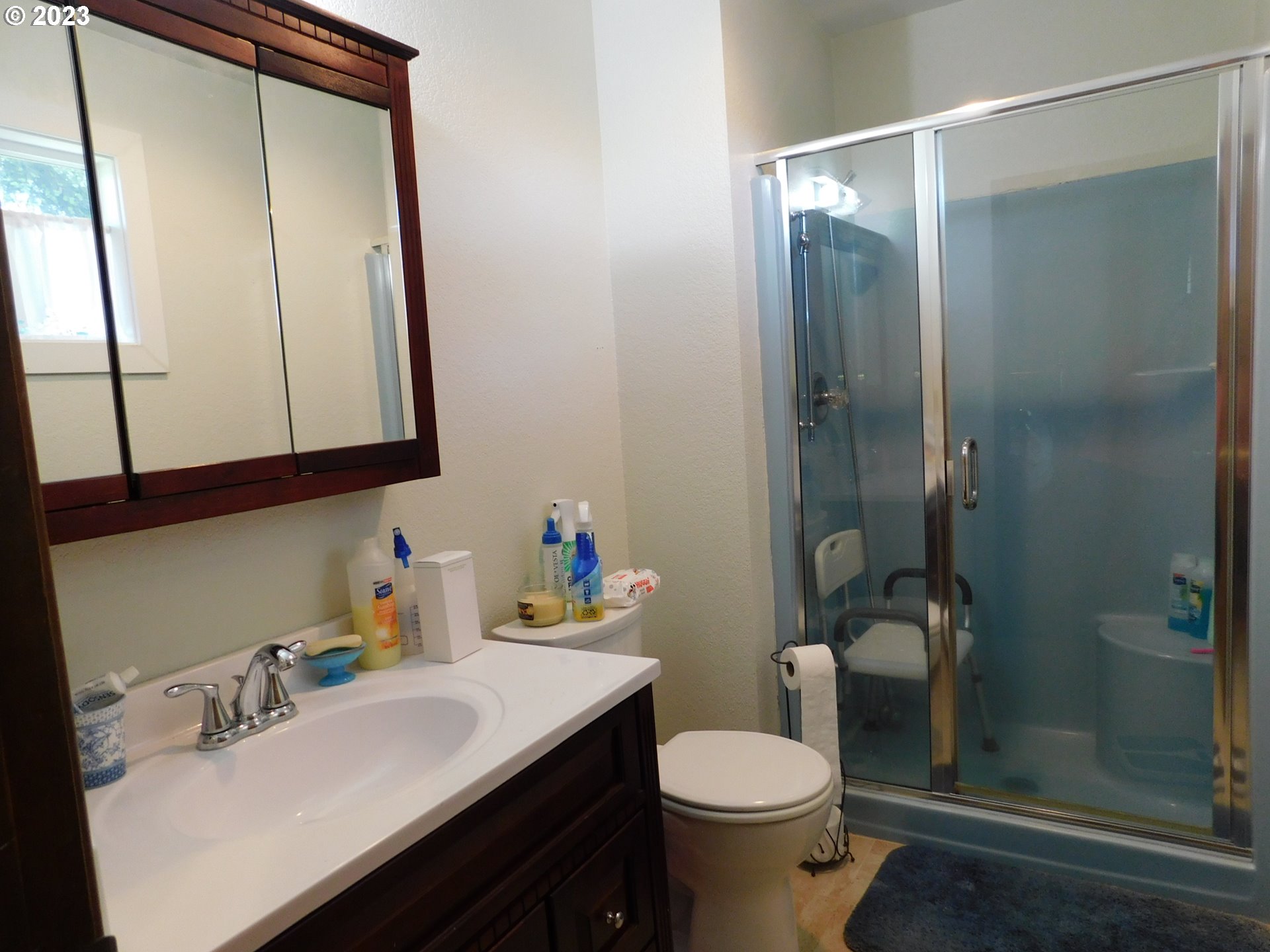 1968 View Street Myrtle Point, OR 97458 - Photo 19 of 27 a bathroom with a sink vanity mirror and toilet