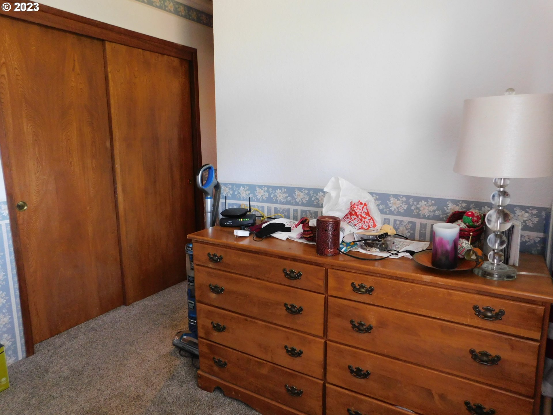 1968 View Street Myrtle Point, OR 97458 - Photo 21 of 27 a bed room with a bed and a closet