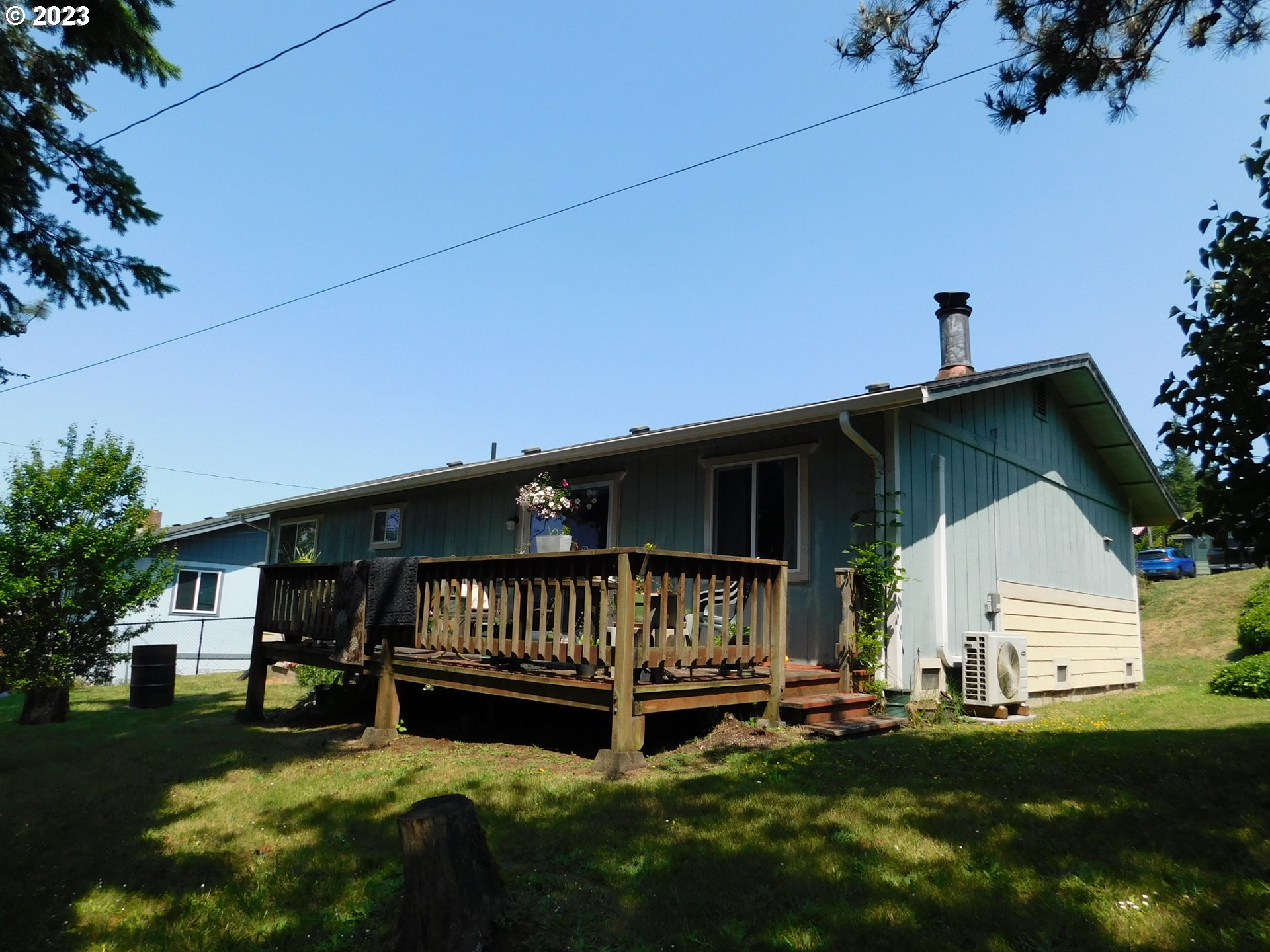 1968 View Street Myrtle Point, OR 97458 - Photo 5 of 27 a view of backyard with a garden and deck