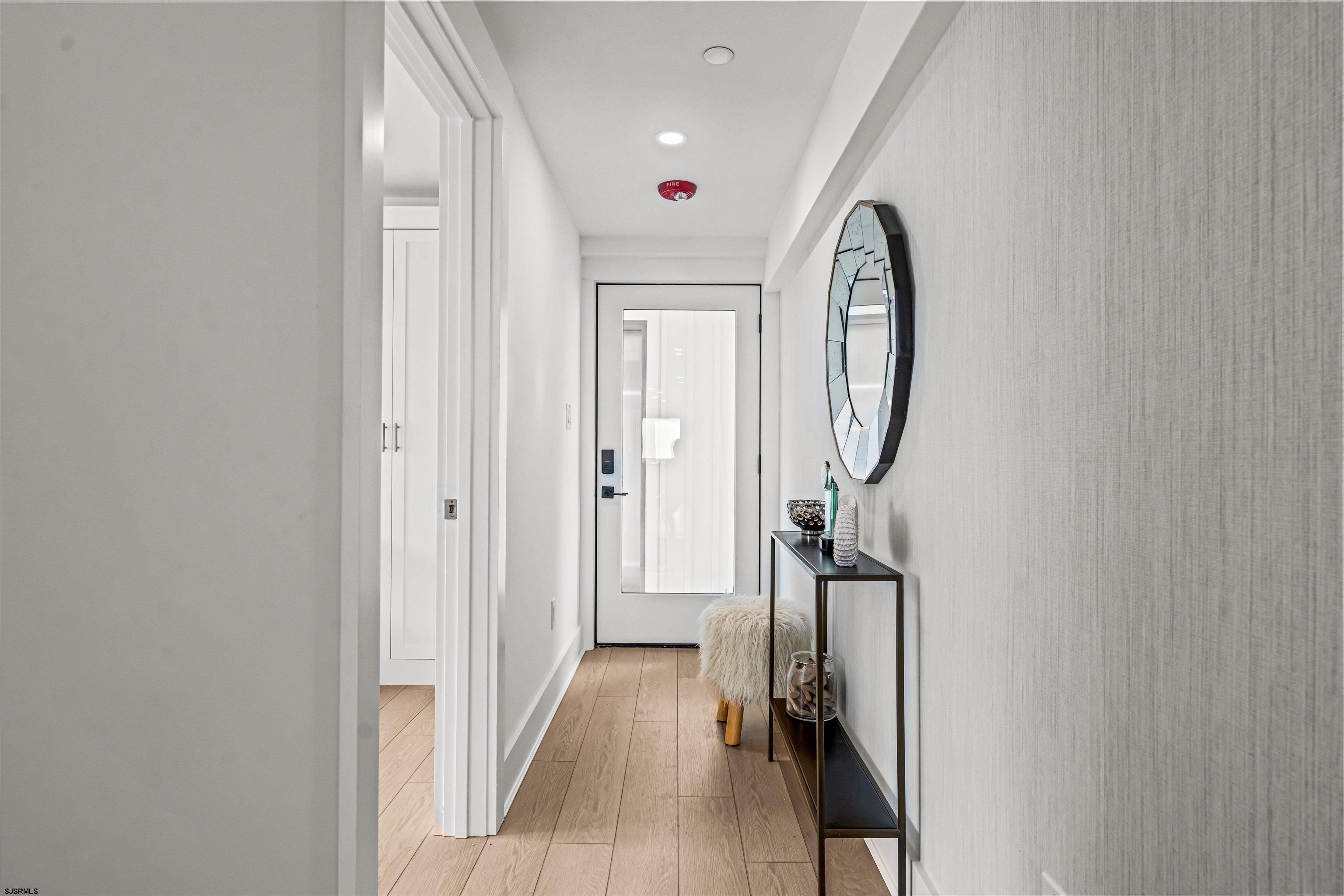 321 South 6th Street, Unit 4 Brigantine, NJ 08203 - Photo 12 of 26 a view of a hallway with windows