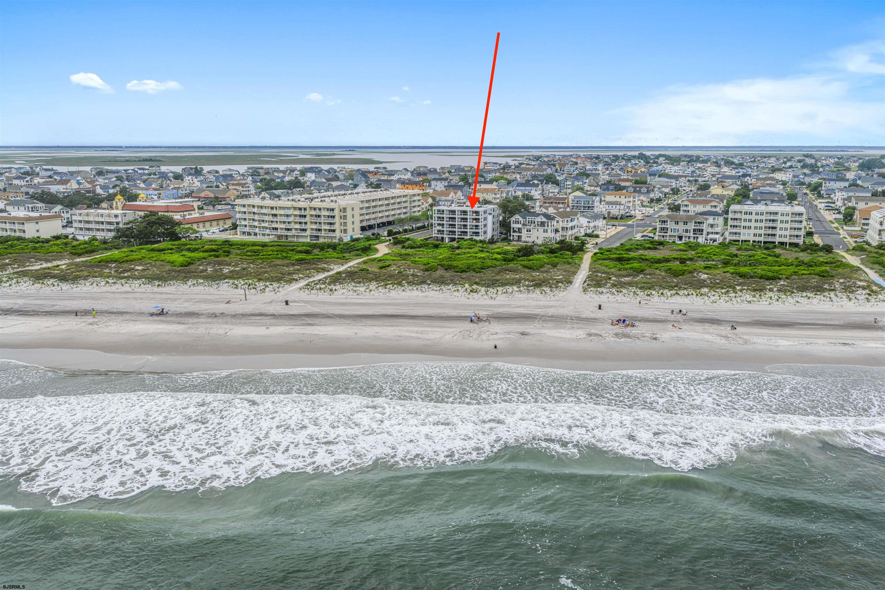 321 South 6th Street, Unit 4 Brigantine, NJ 08203 - Photo 13 of 26 a view of a beach with a yard
