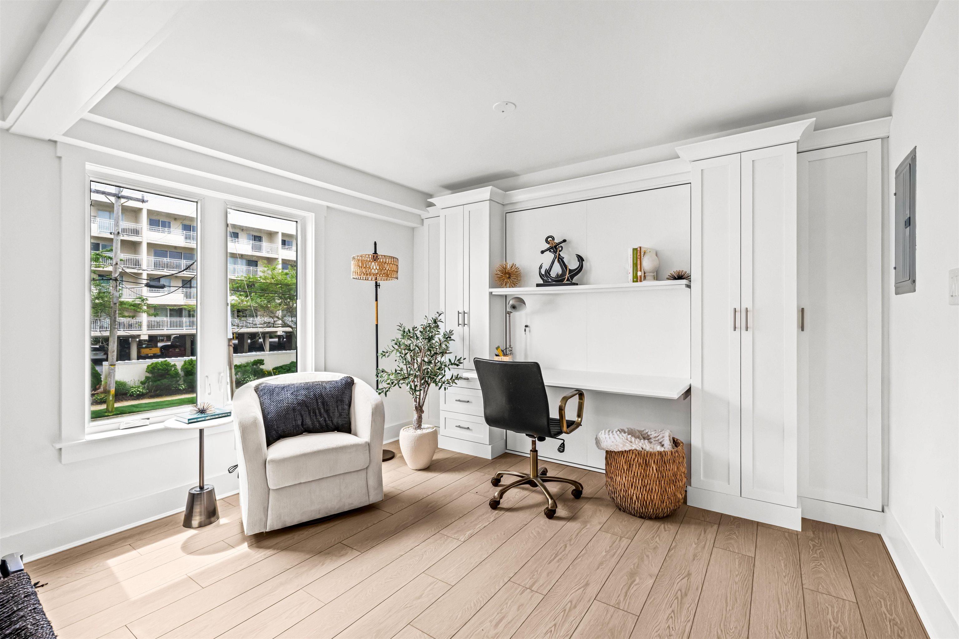 321 South 6th Street, Unit 4 Brigantine, NJ 08203 - Photo 14 of 26 a living room with furniture and a wooden floor