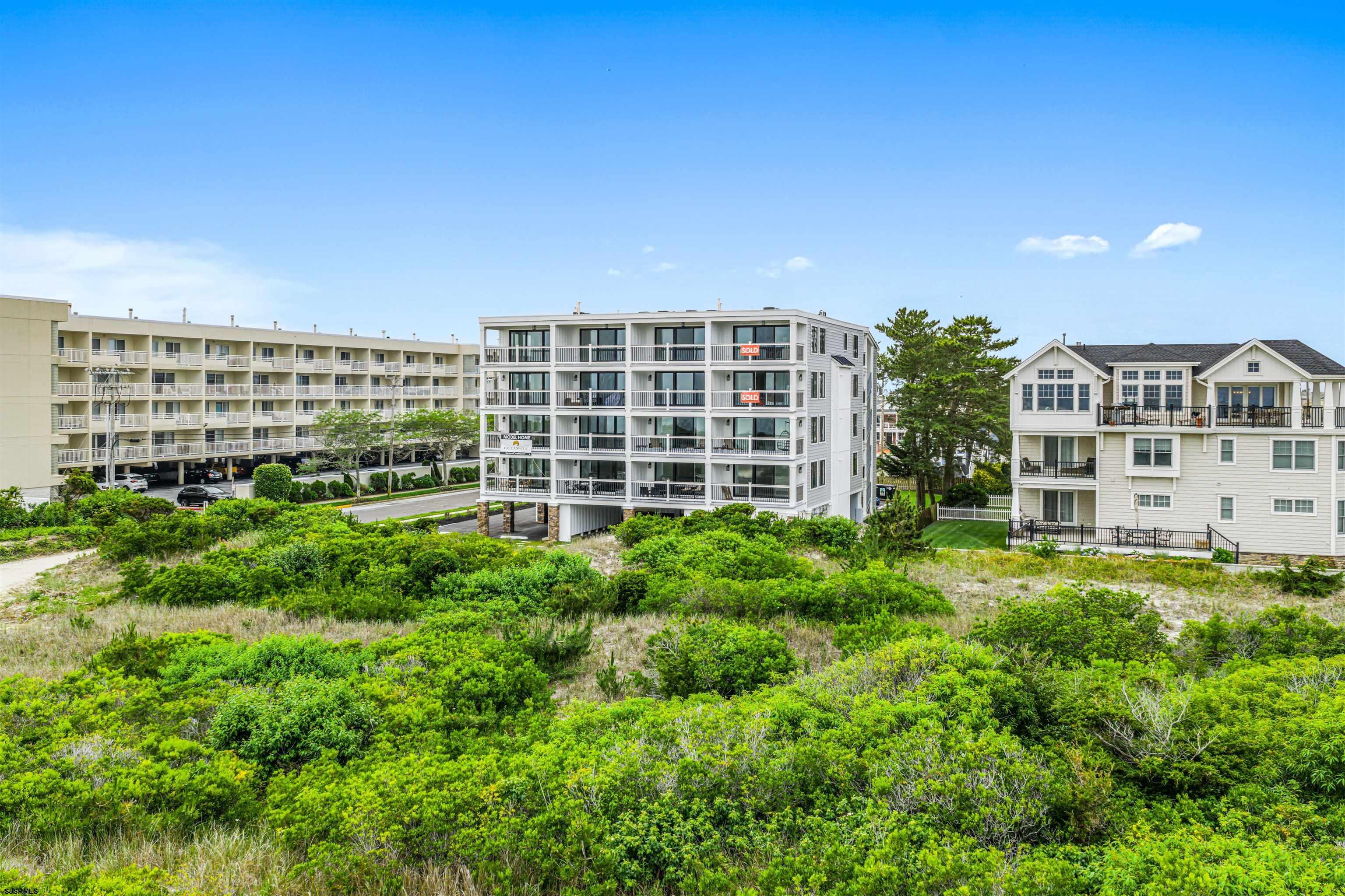 321 South 6th Street, Unit 4 Brigantine, NJ 08203 - Photo 16 of 26 a view of building with a garden