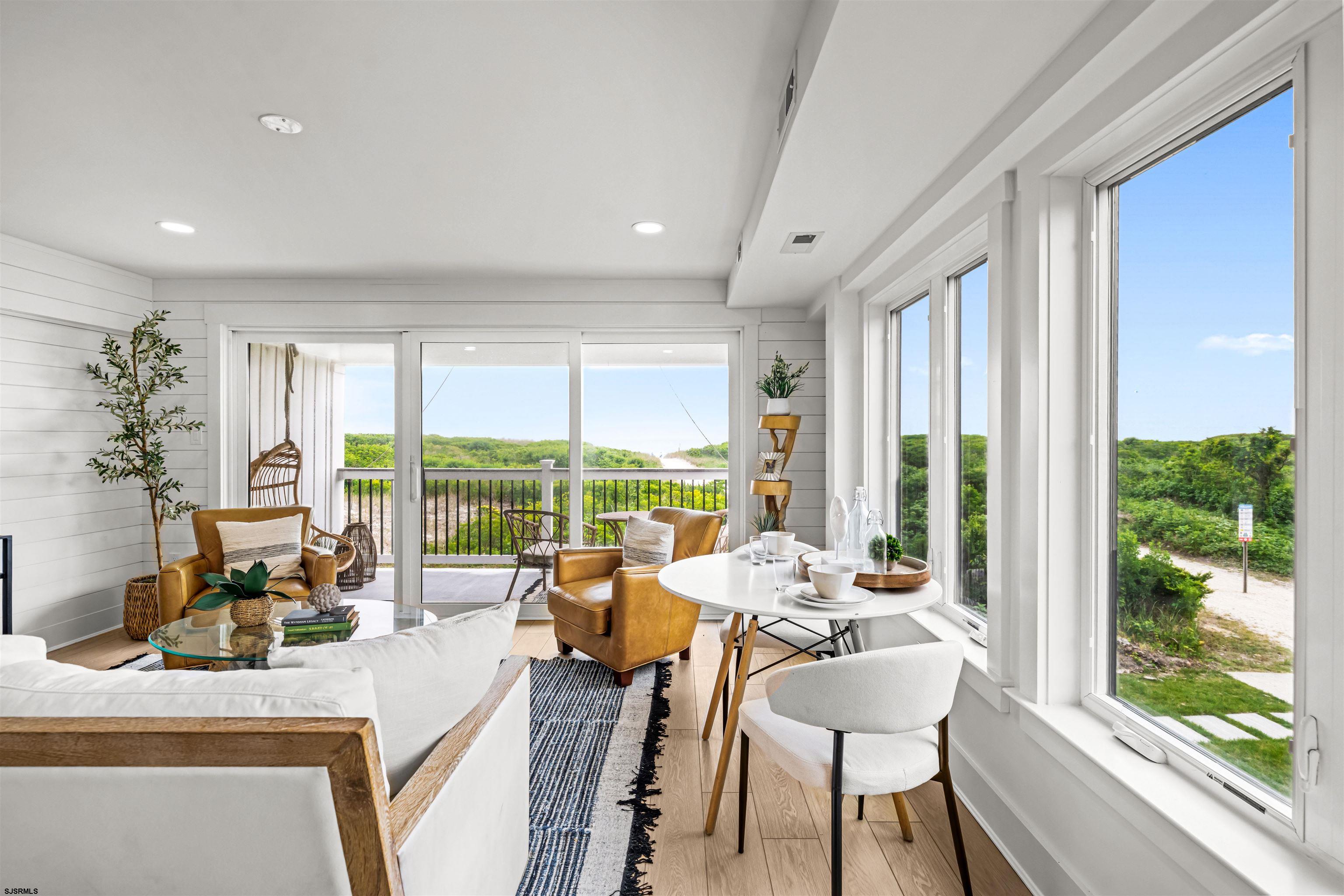 321 South 6th Street, Unit 4 Brigantine, NJ 08203 - Photo 19 of 26 a living room with furniture and large windows