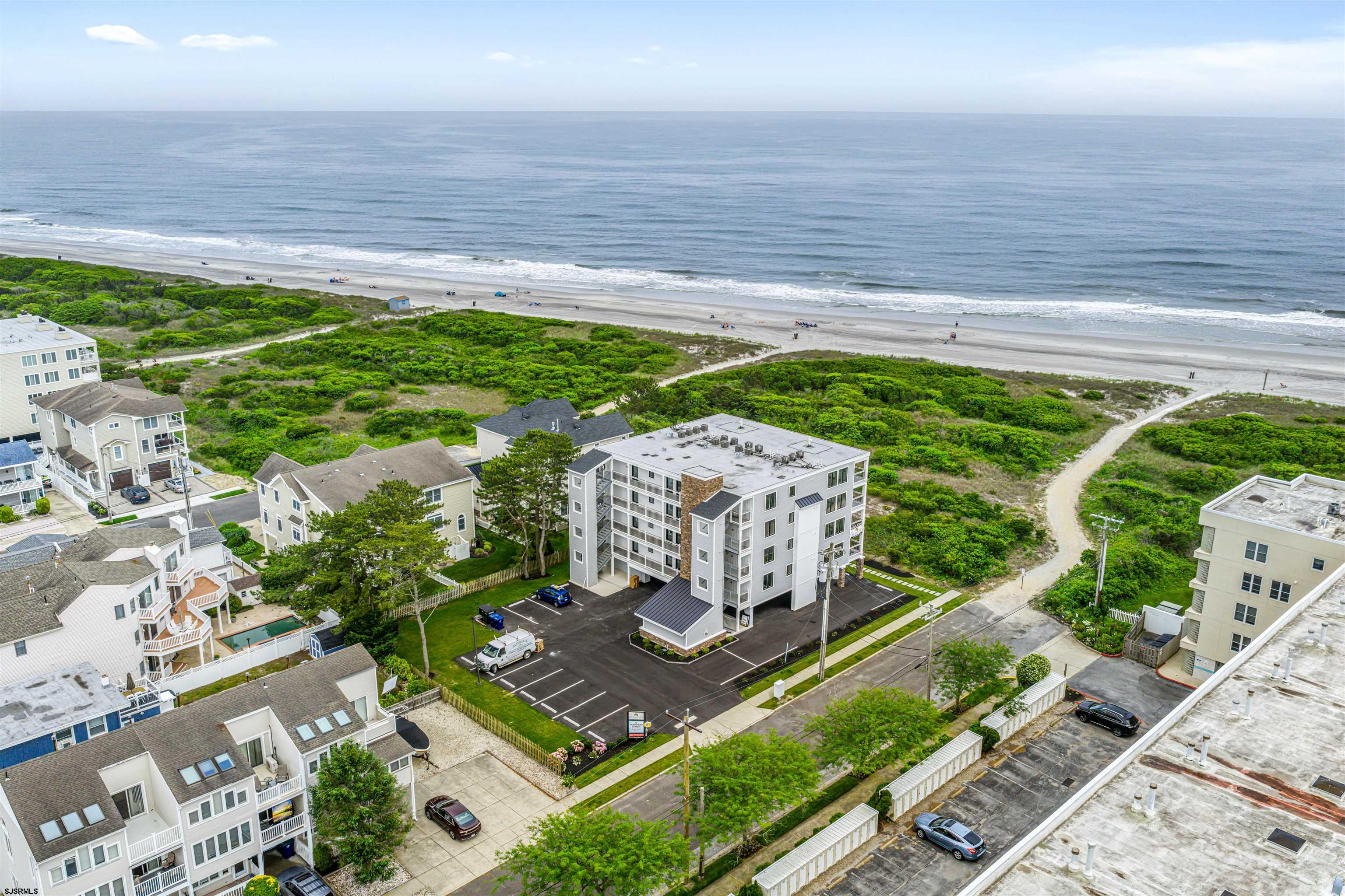 321 South 6th Street, Unit 4 Brigantine, NJ 08203 - Photo 2 of 26 a view of a garden with an ocean