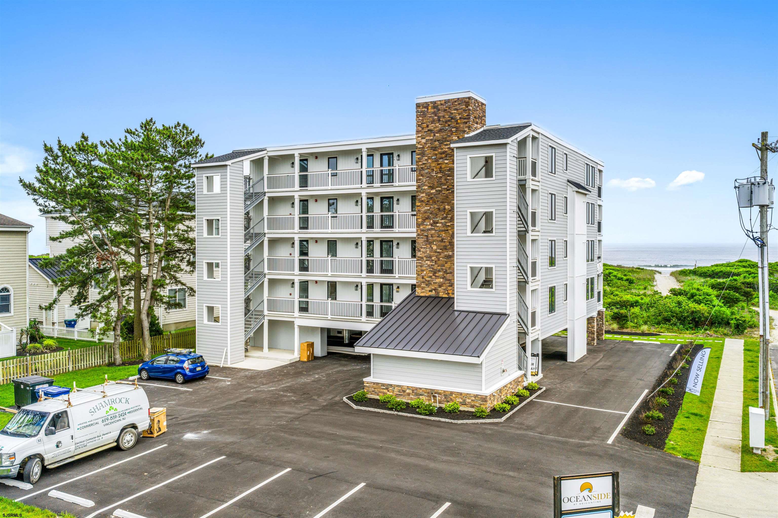 321 South 6th Street, Unit 4 Brigantine, NJ 08203 - Photo 3 of 26 a front view of a building with garden