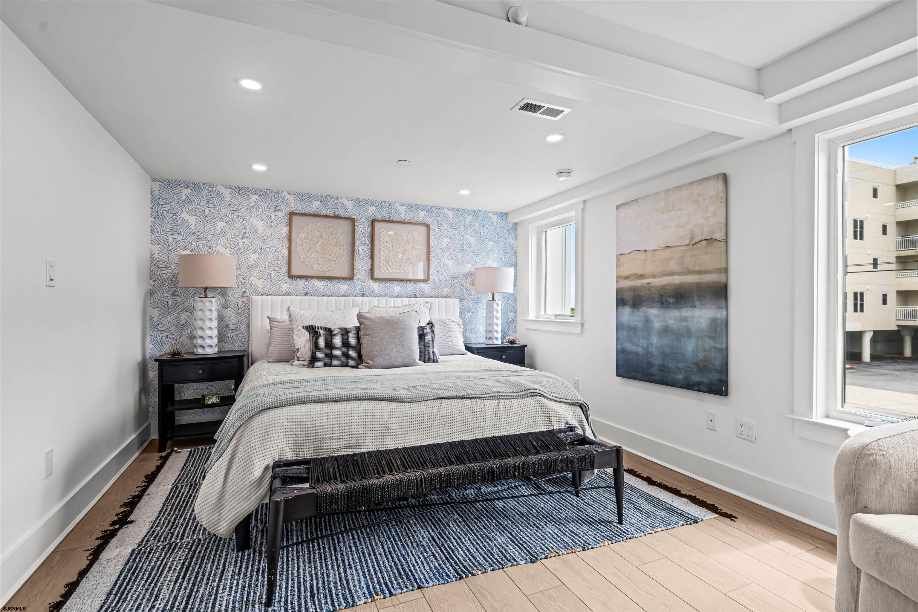 321 South 6th Street, Unit 4 Brigantine, NJ 08203 - Photo 4 of 26 a bedroom with a bed and a large window