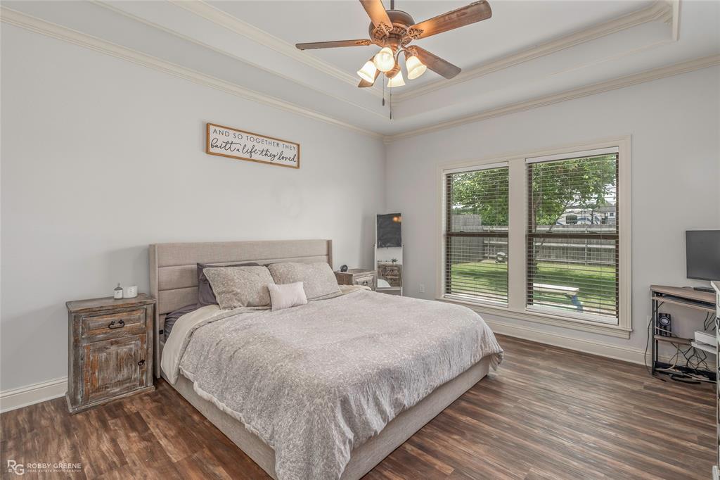 711 Reeds Reef Bossier City, LA 71112 - Photo 16 of 36 a bedroom with a large bed and a tv