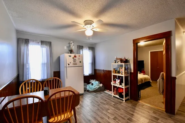 a bedroom with furniture and a chandelier