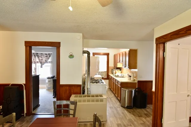 a living room with fireplace furniture and a window