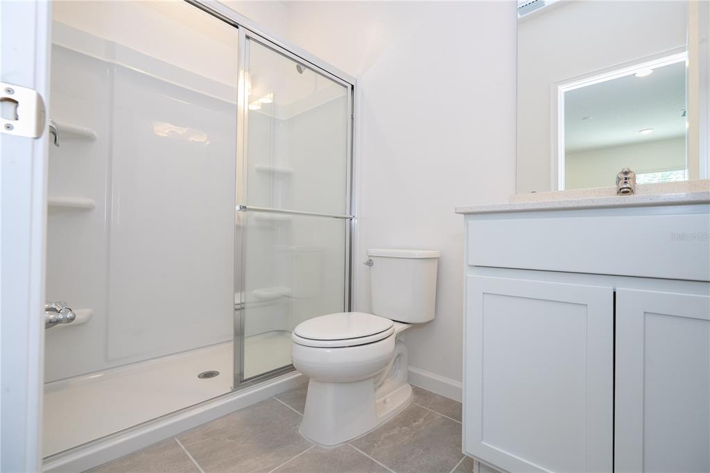 10580 Ebb Tide Lane Orlando, FL 32821 - Photo 40 of 58 a bathroom with a sink toilet and shower