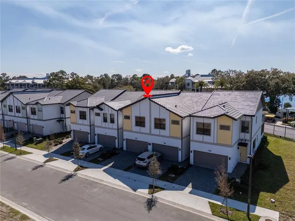 a aerial view of a house with swimming pool and furniture