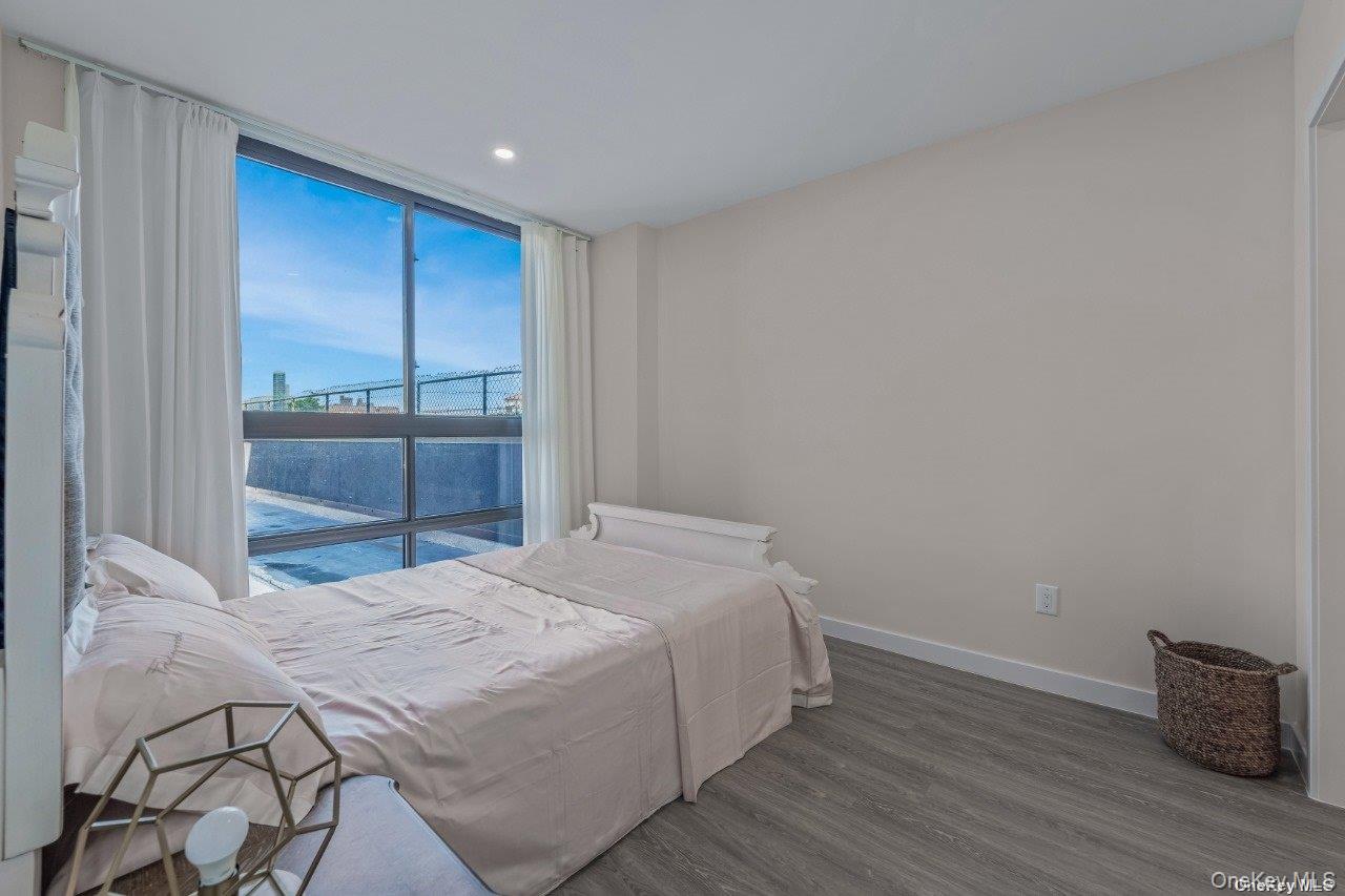 43-30 52nd Street, Unit 3B Queens, NY 11377 - Photo 13 of 14 a bedroom with a bed and a dresser