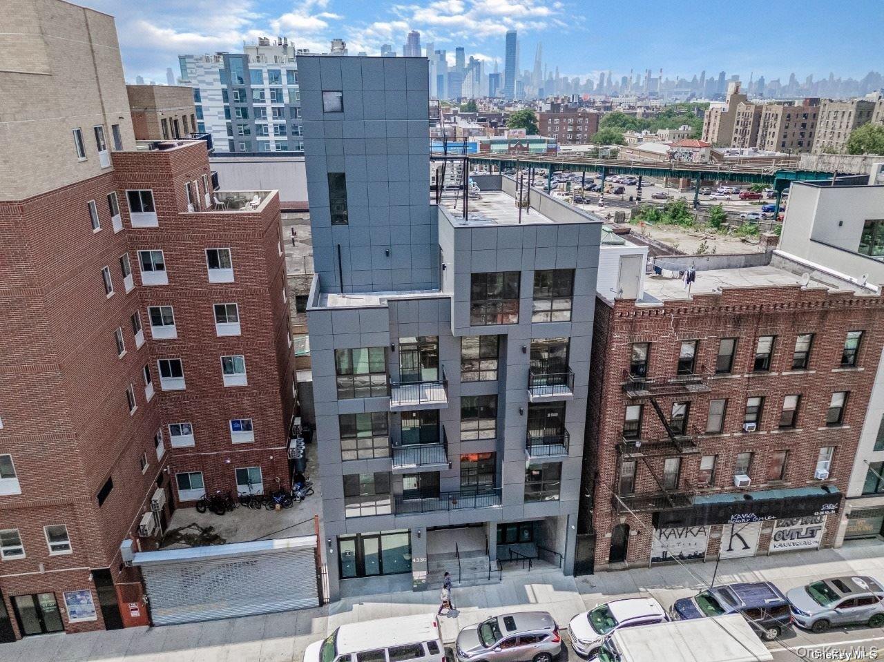 43-30 52nd Street, Unit 3B Queens, NY 11377 - Photo 2 of 14 a city view with tall buildings