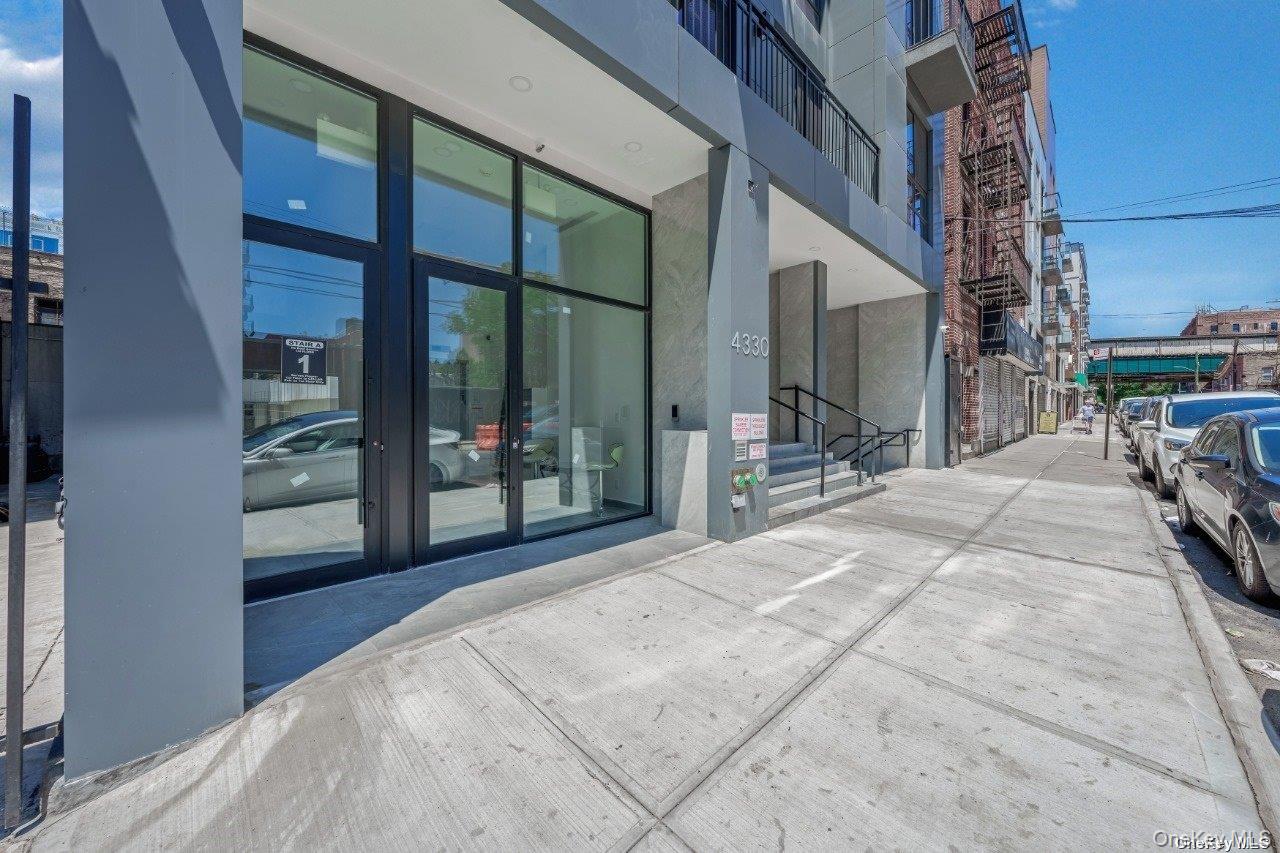 43-30 52nd Street, Unit 3B Queens, NY 11377 - Photo 3 of 14 a view of a porch with a table and chairs
