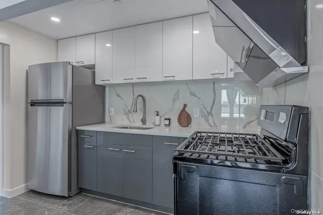 a kitchen with a stove and a refrigerator