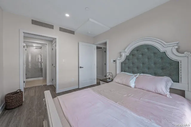 a bedroom with bed and a dresser