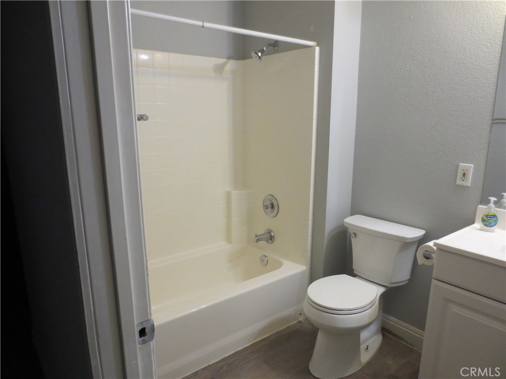 5855 Challen Avenue Riverside, CA 92503 - Photo 10 of 19 a white toilet sitting next to a bath tub