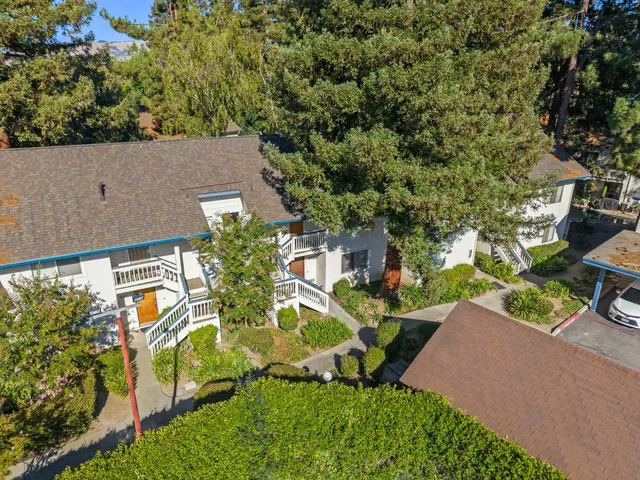 an aerial view of a house with yard swimming pool and outdoor seating