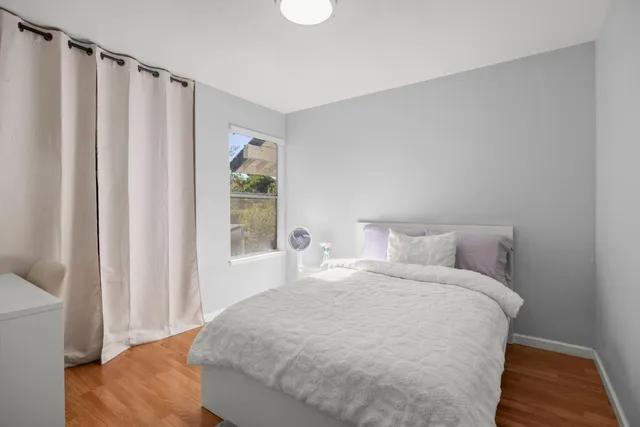 a large white bed in a white room