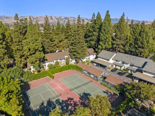 an aerial view of a house with a garden