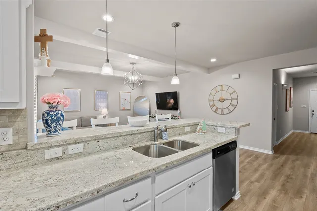 a kitchen with cabinets a sink and a stove
