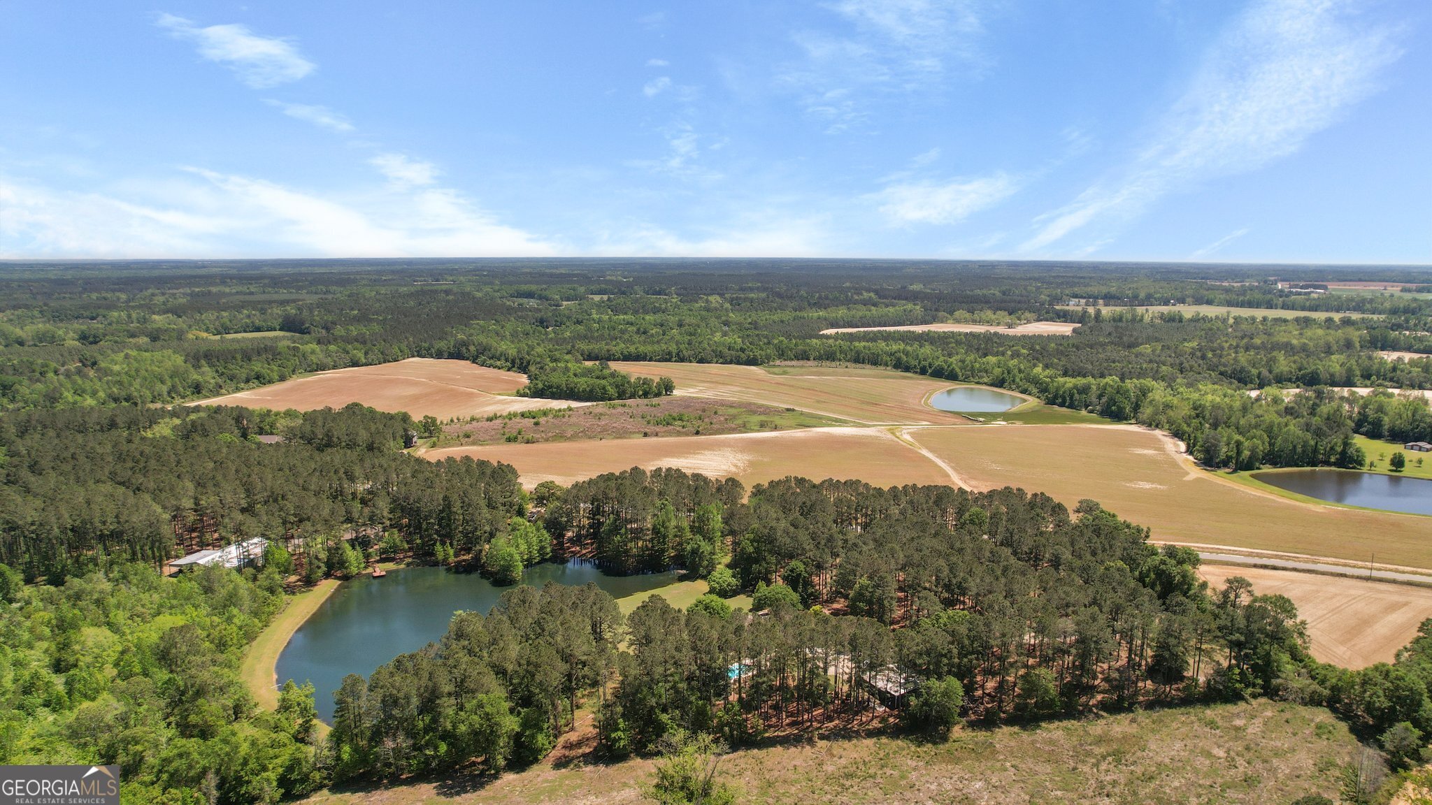 0 Middleground Road, Unit TRACT 2 Statesboro, GA 30461 - Photo 7 of 17 an aerial view of residential houses with outdoor space and trees