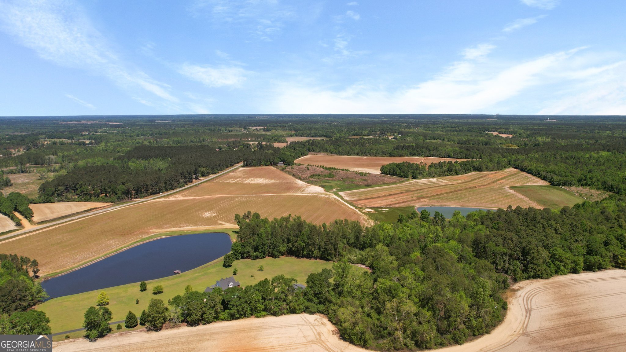 0 Middleground Road, Unit TRACT 2 Statesboro, GA 30461 - Photo 9 of 17 a view of a lake with a garden