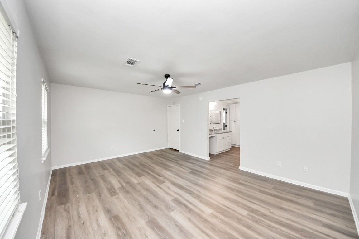 3923 Cypress Lake Drive Spring, TX 77388 - Photo 23 of 41 Master Bedroom with beautiful new flooring leading to Bathroom En Suite.
