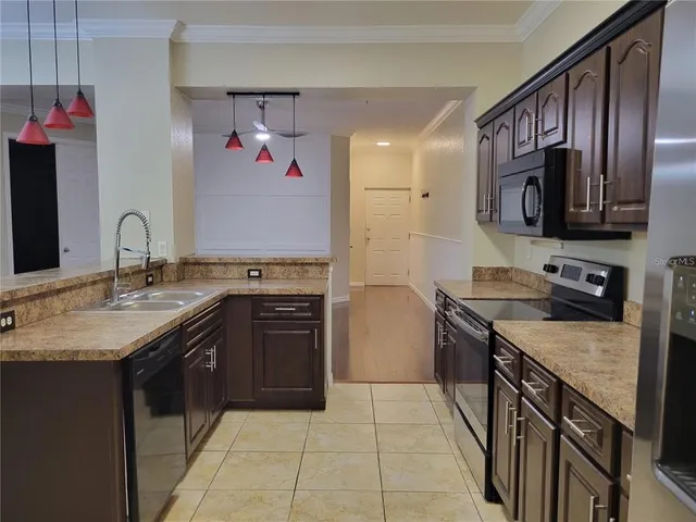 a kitchen with a stove top oven sink and cabinets