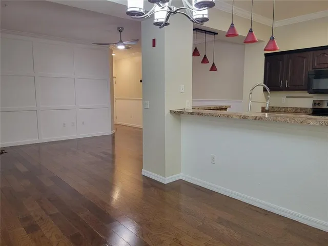 a view of a kitchen with wooden floor