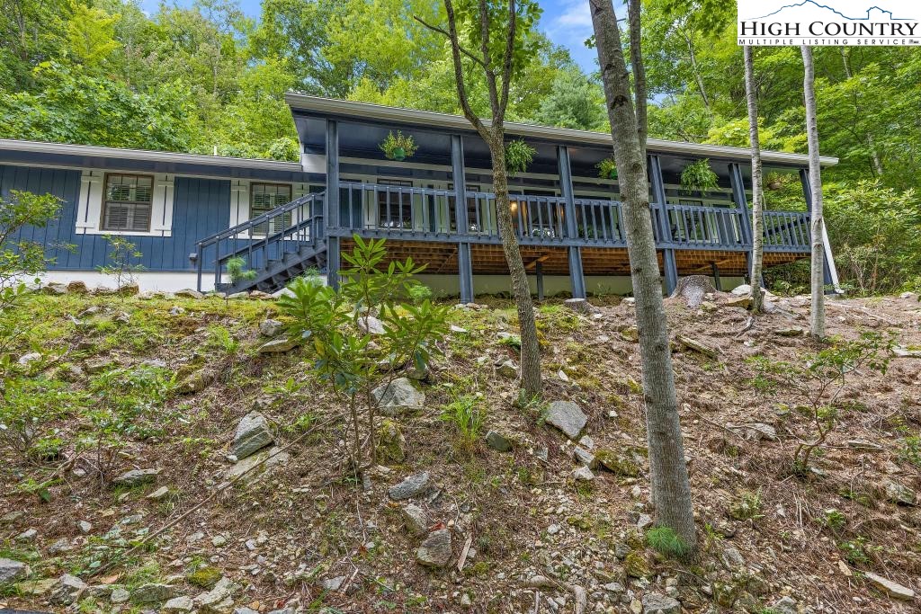 1157 Pine Ridge Road Beech Mountain, NC 28604 - Photo 2 of 41 a house view with a garden space