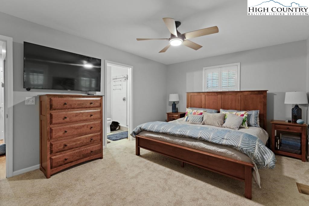 1157 Pine Ridge Road Beech Mountain, NC 28604 - Photo 22 of 41 a bedroom with a bed and a flat screen tv
