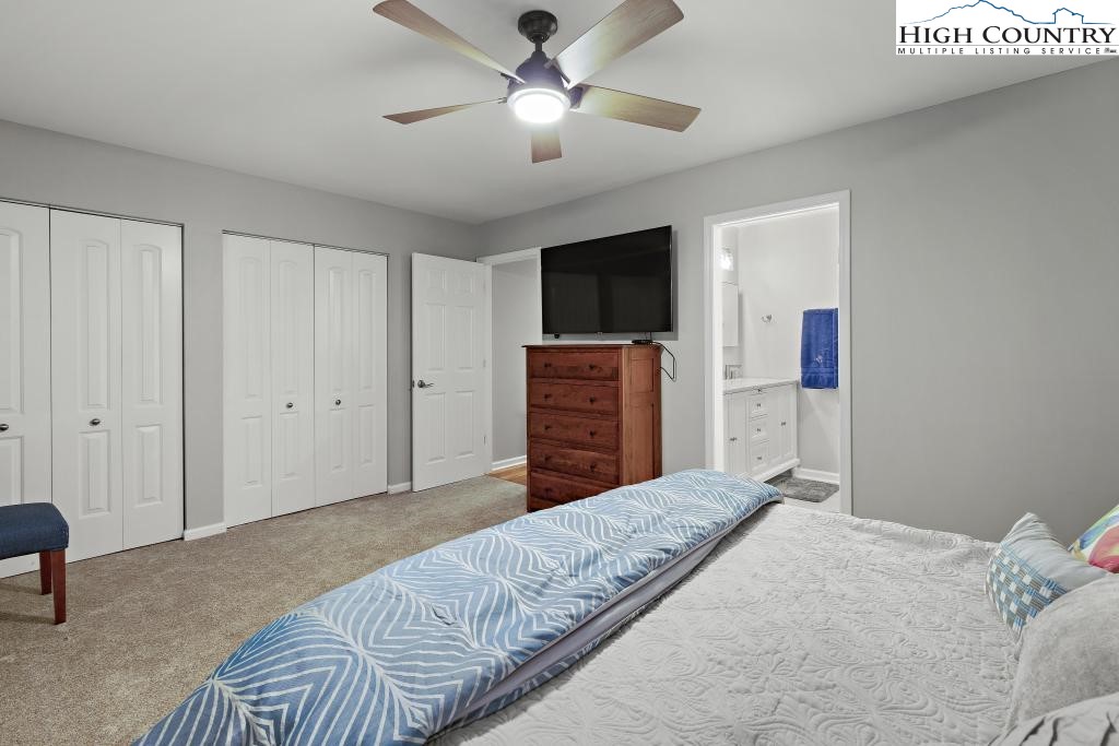 1157 Pine Ridge Road Beech Mountain, NC 28604 - Photo 23 of 41 a bedroom with a bed and a flat screen tv