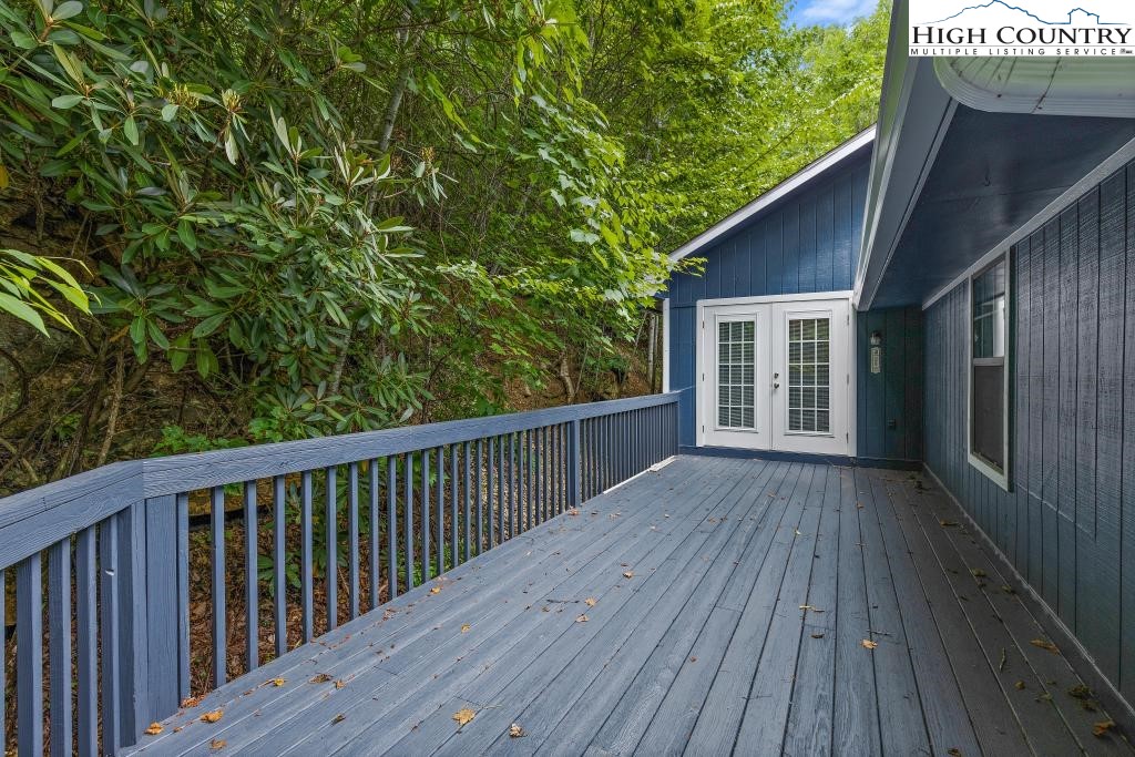 1157 Pine Ridge Road Beech Mountain, NC 28604 - Photo 24 of 41 a view of backyard with deck and wooden floor