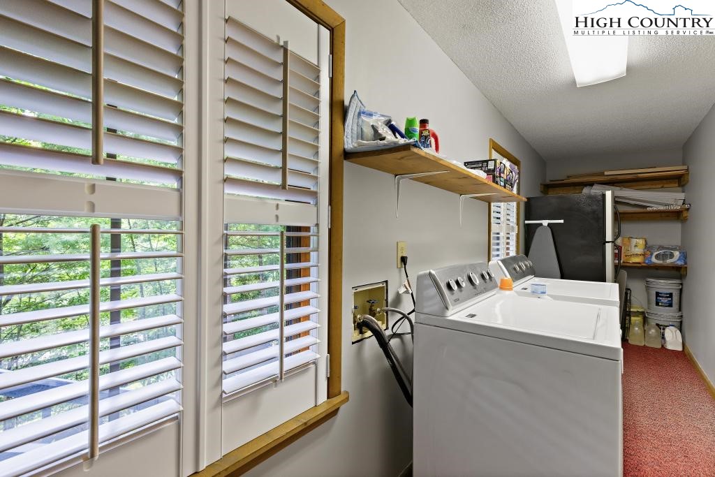 1157 Pine Ridge Road Beech Mountain, NC 28604 - Photo 27 of 41 a room with water heater and a window