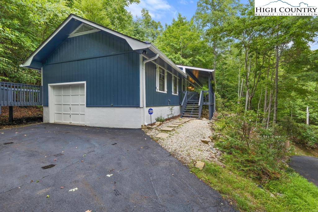 1157 Pine Ridge Road Beech Mountain, NC 28604 - Photo 4 of 41 a house view with a backyard space