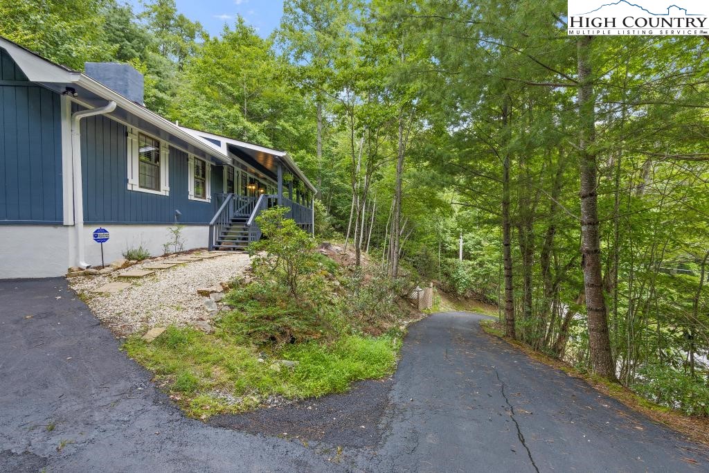 1157 Pine Ridge Road Beech Mountain, NC 28604 - Photo 5 of 41 a view of a house with a yard
