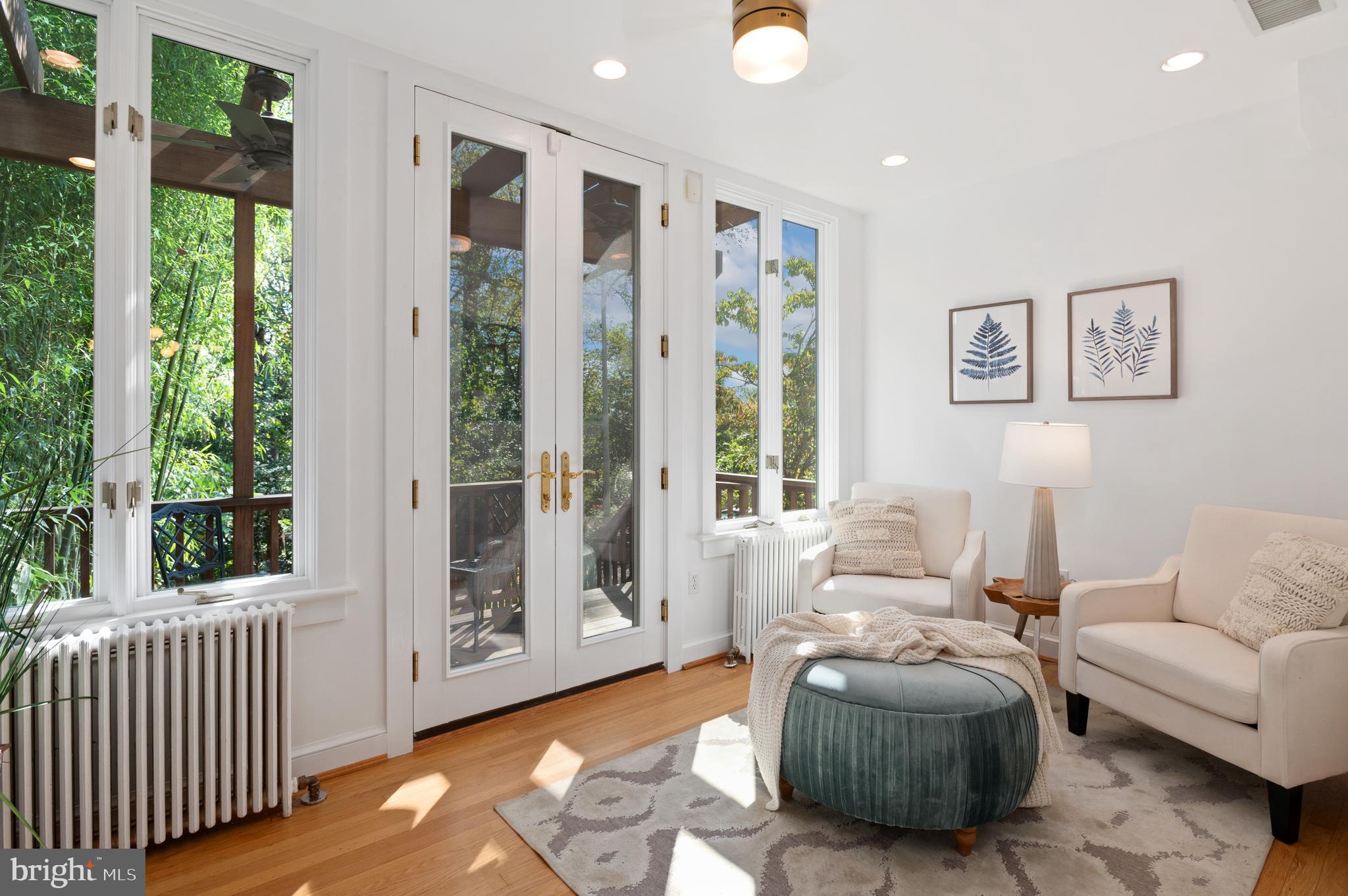 1955 39th Street Northwest Washington, DC 20007 - Photo 12 of 25 Sunroom overlooks rear gardens and national park