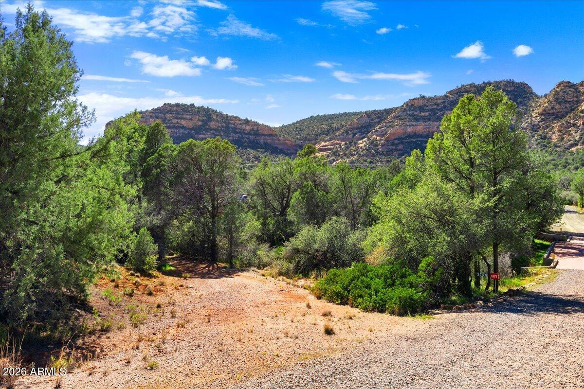 2727 Verde Valley School Road Sedona, AZ 86336 - Photo 19 of 22 a view of a dry yard with trees