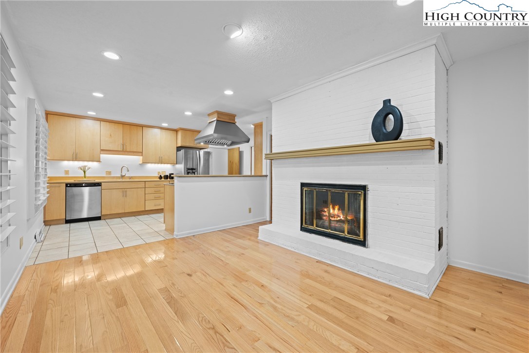 164 Appalachian Drive Boone, NC 28607 - Photo 12 of 43 a view of a kitchen with a stove wooden cabinets and wooden floor
