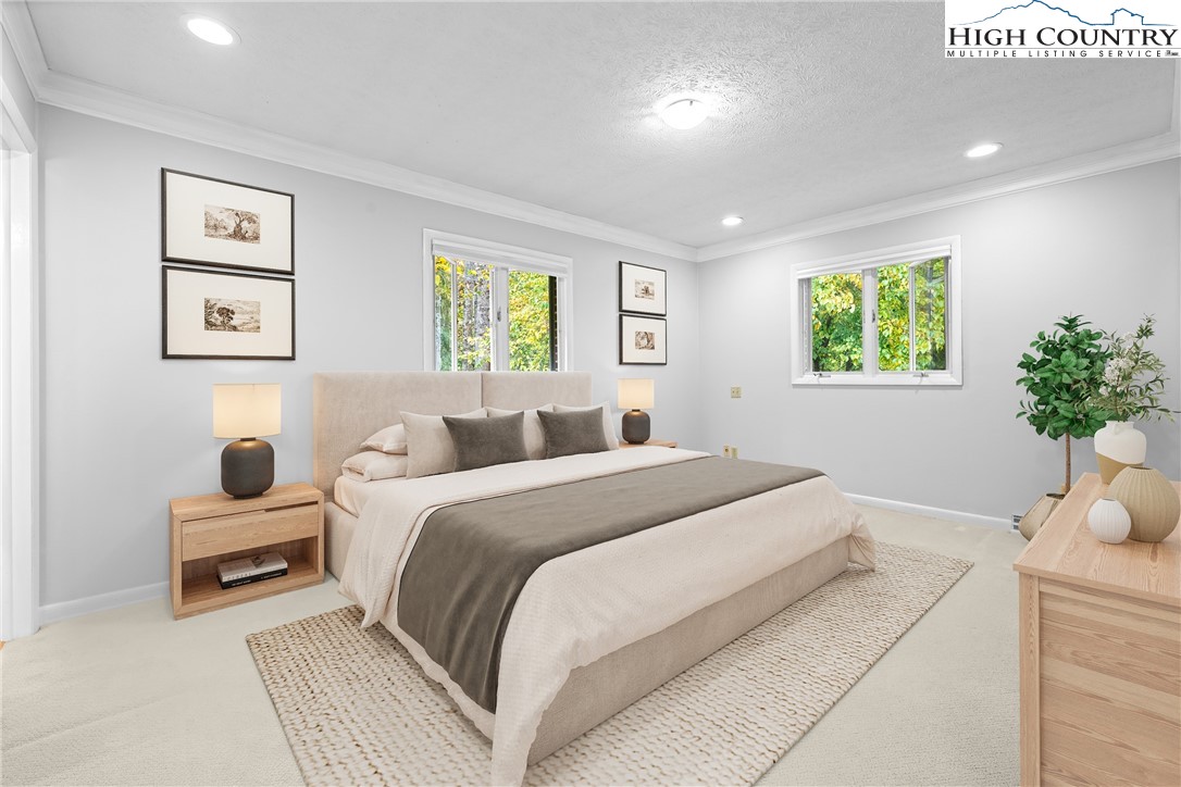 164 Appalachian Drive Boone, NC 28607 - Photo 15 of 43 a bedroom with bed and a potted plant