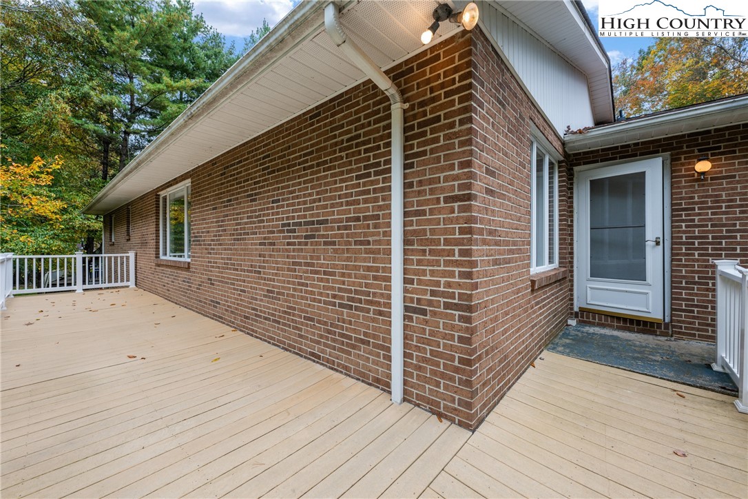 164 Appalachian Drive Boone, NC 28607 - Photo 27 of 43 a view of a house with a wooden deck