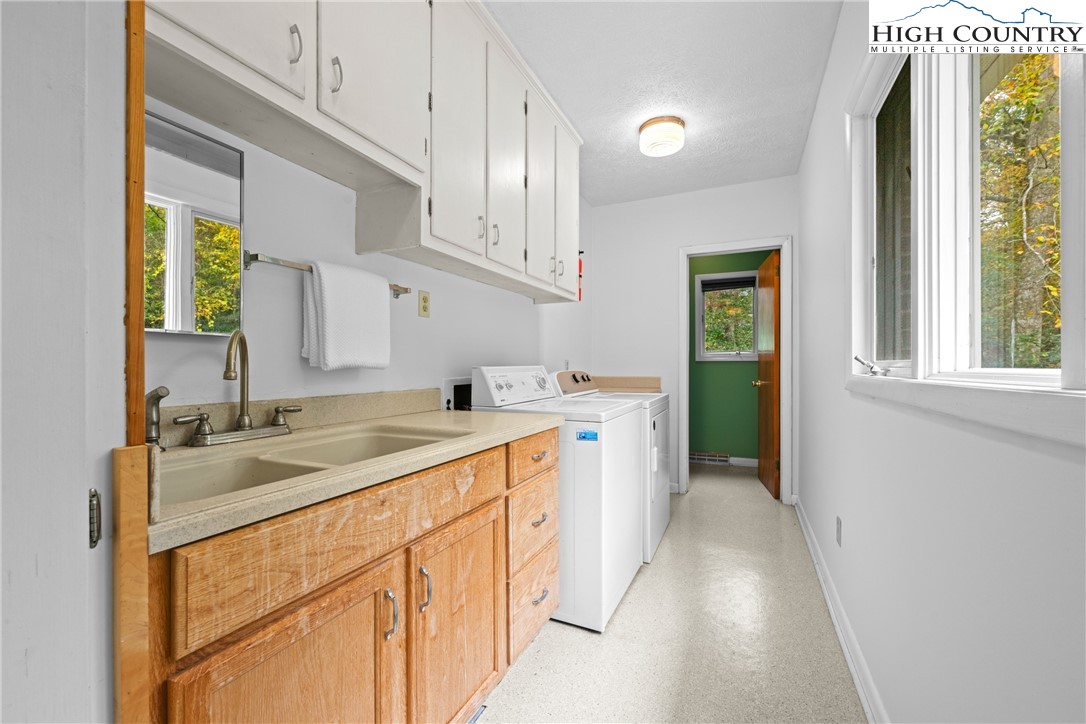 164 Appalachian Drive Boone, NC 28607 - Photo 29 of 43 a utility room with cabinets washer and dryer