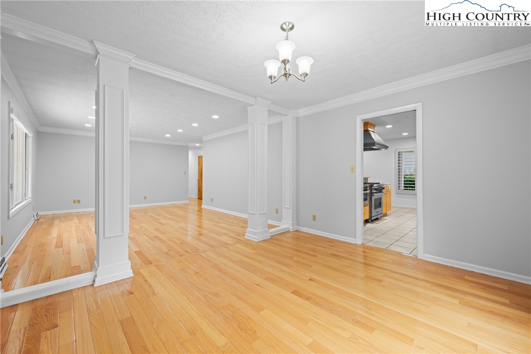 164 Appalachian Drive Boone, NC 28607 - Photo 7 of 43 a big room with wooden floor and chandelier