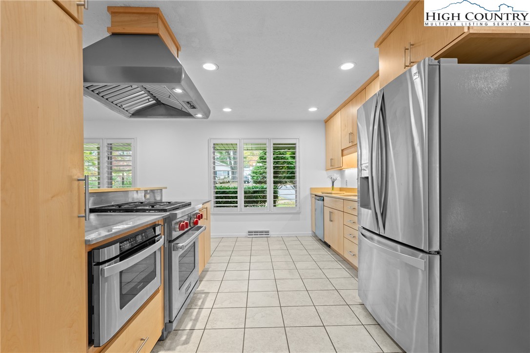 164 Appalachian Drive Boone, NC 28607 - Photo 9 of 43 a kitchen with a stove a sink and a refrigerator